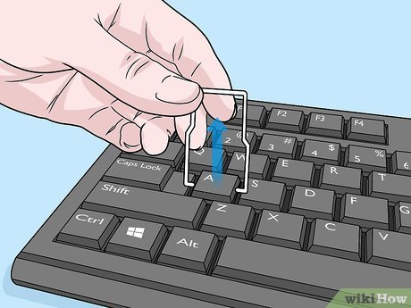 Trennen Sie die Verbindungskabel der Tastatur vorsichtig von der Hauptplatine.
Entfernen Sie die alte Tastatur und legen Sie sie beiseite.